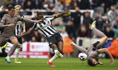 Newcastle United's Alexander Isak, centre, scores the opening goal during the English Premier League soccer match between Newcastle United and Tottenham Hotspur at St. James' Park in Newcastle, England, Saturday, April 13, 2024. (Owen Humphreys/PA via AP)