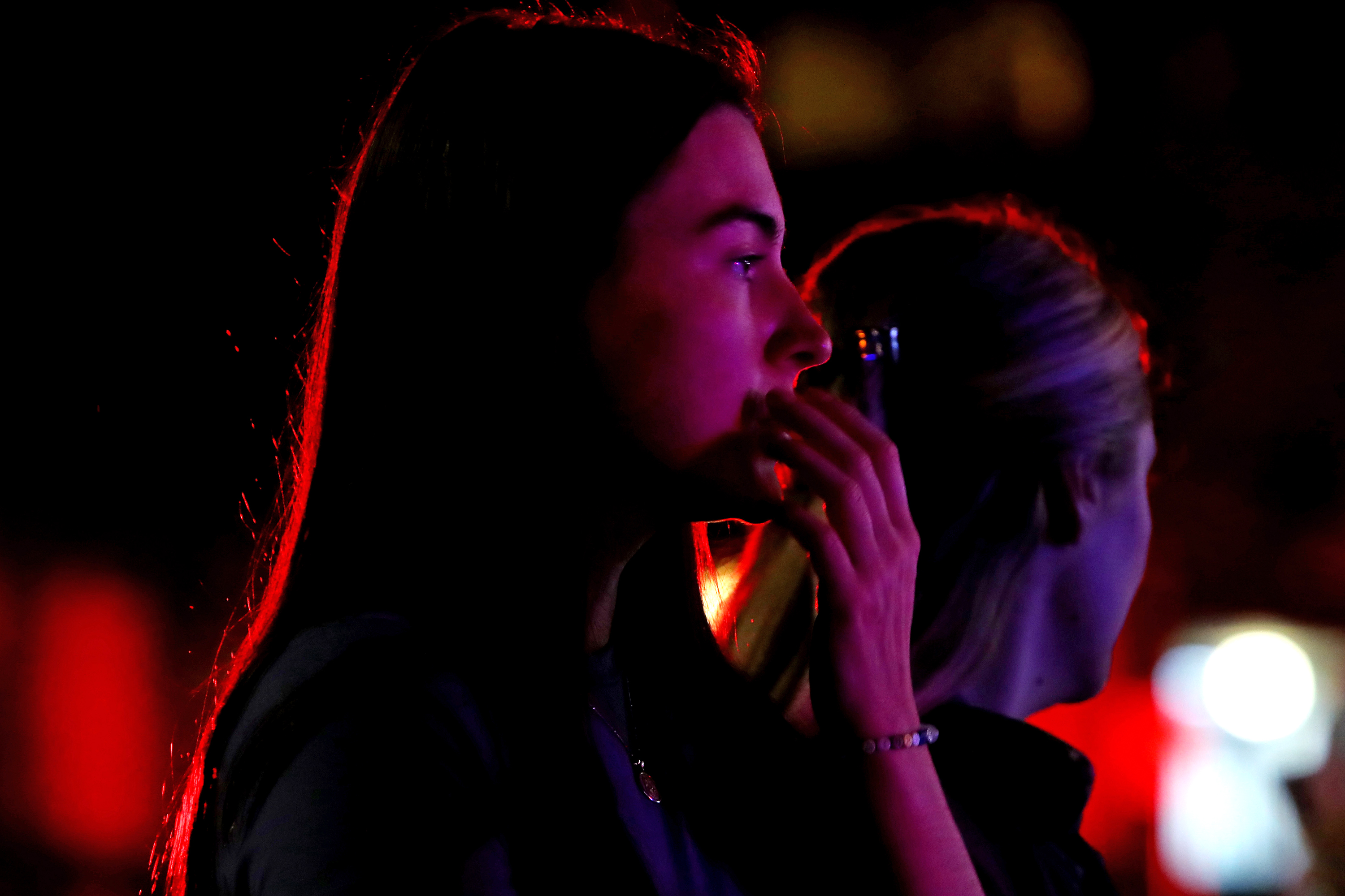 People react outside Westfield Bondi Junction shopping center on Saturday. 