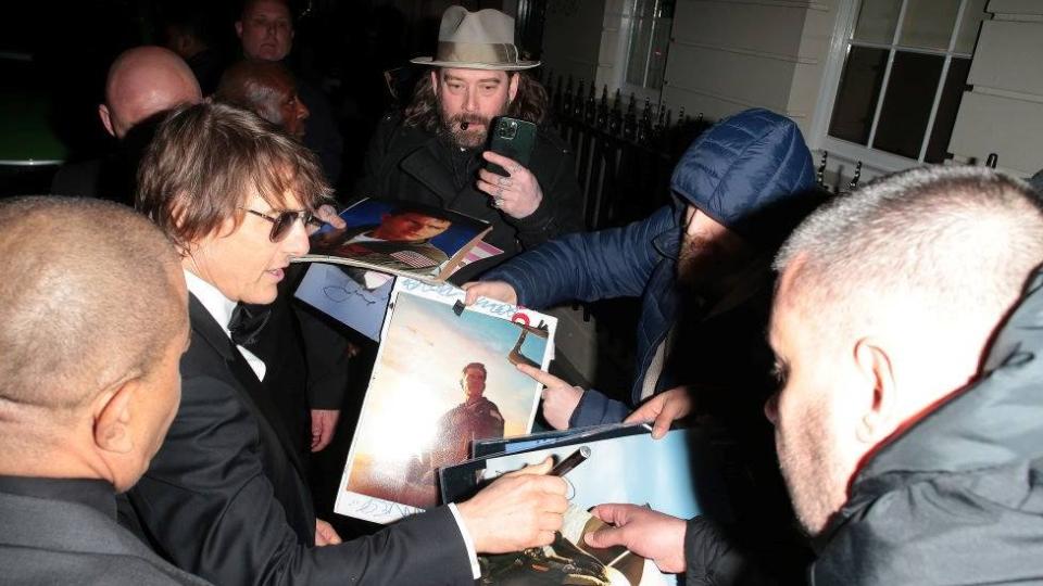 Tom Cruise (second left)