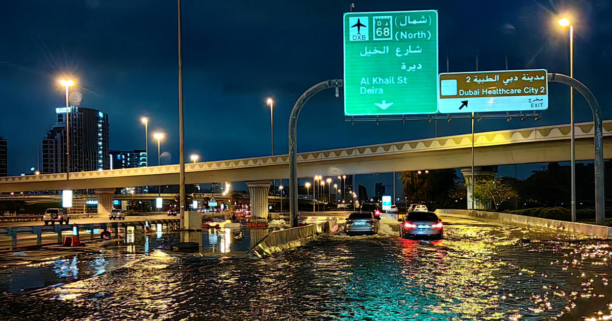 Dubai flooding hobbles major airport's operations as "historic weather event" brings torrential rains to UAE