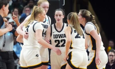 Iowa's Caitlin Clark talks with teammates in a huddle in the fourth quarter against LSU.