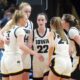 Iowa's Caitlin Clark talks with teammates in a huddle in the fourth quarter against LSU.