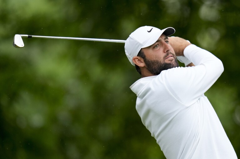 Scottie Scheffler watches his tee shot on the 11th hole during the second round of the PGA Championship golf tournament at the Valhalla Golf Club, Friday, May 17, 2024, in Louisville, Ky. (AP Photo/Jeff Roberson)