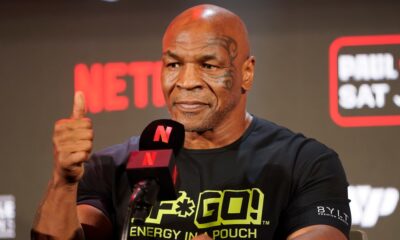 Mike Tyson gestures to the crowd during a news conference promoting his upcoming boxing bout against Jake Paul, Thursday, May 16, 2024, in Arlington, Texas. The fight is scheduled for July 20. (AP Photo/Sam Hodde)