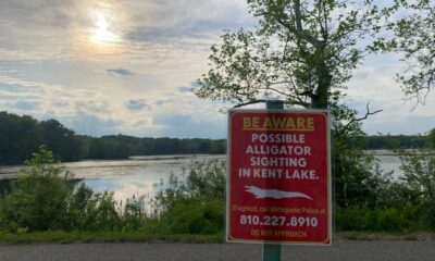 Huron-Clinton Metroparks officials posted warning signs around Kent Lake after a visitor reported seeing an alligator on Thursday.