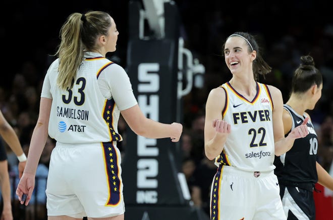 Caitlin Clark celebrates with Indiana Fever teammate Katie Lou Samuelson during a 99-80 loss to the Las Vegas Aces on May 25.