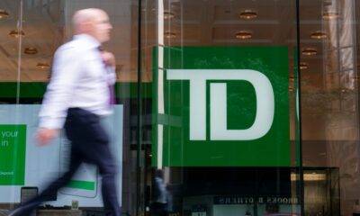 A person makes their way past a Toronto-Dominion Bank in the Financial District of Toronto on August 14, 2023. THE CANADIAN PRESS/Spencer Colby