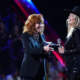 Watch Reba McEntire Surprise Lainey Wilson With Grand Ole Opry Invitation