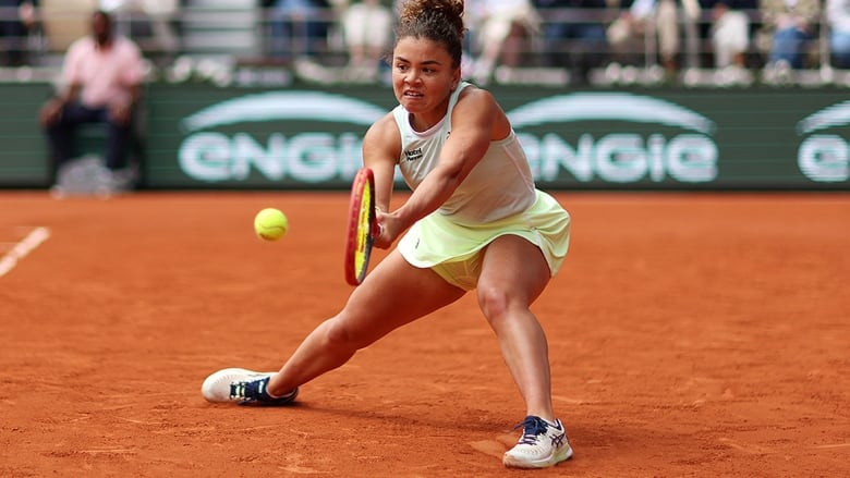 An Italian women's tennis player delivers a backhand shot against her Kazakhstan opponent during the French Open quarterfinals June 5, 2024 in Paris. 