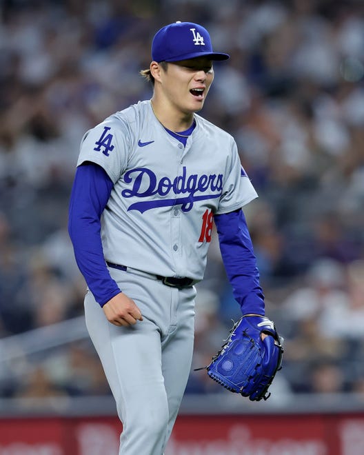 Jun 7, 2024; Bronx, New York, USA; Los Angeles Dodgers starting pitcher Yoshinobu Yamamoto (18) reacts during the sixth inning against the New York Yankees at Yankee Stadium. Mandatory Credit: Brad Penner-USA TODAY Sports