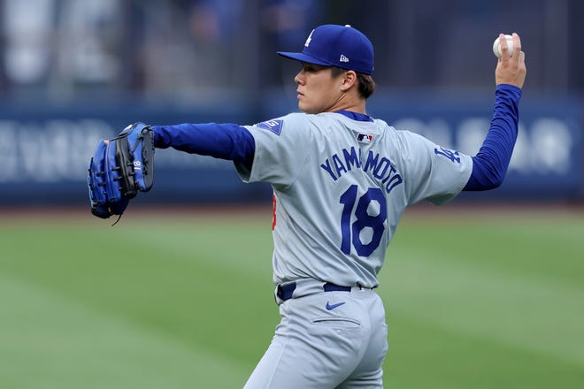 Jun 7, 2024; Bronx, New York, USA; Los Angeles Dodgers starting pitcher Yoshinobu Yamamoto (18) warms up before his start against the New York Yankees at Yankee Stadium. Mandatory Credit: Brad Penner-USA TODAY Sports