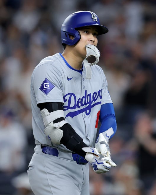 Jun 7, 2024; Bronx, New York, USA; Los Angeles Dodgers designated hitter Shohei Ohtani (17) reacts after grounding out to end the top of the tenth inning against the New York Yankees at Yankee Stadium. Mandatory Credit: Brad Penner-USA TODAY Sports