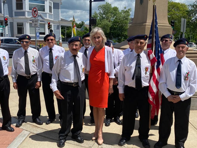 Taunton Mayor Shaunna O' Connell, center, stands with representatives of the Veterans Association for the Portuguese Armed Forces on Saturday, June 8, 2024 at the Day of Portugal flag raising ceremony.