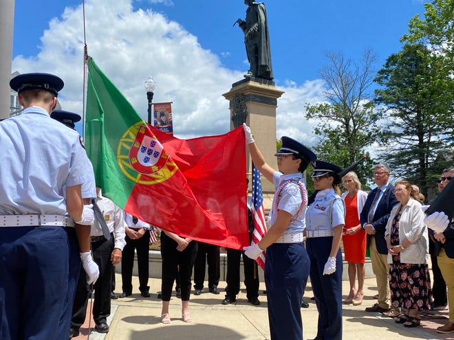 Members of the Taunton Air Force Junior ROTC raise the Portuguese flag outside Taunton City Hall on Saturday, June 8 2024.