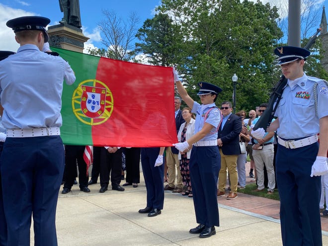 Members of the Taunton Air Force Junior ROTC raise the Portuguese flag outside Taunton City Hall on Saturday, June 8 2024.