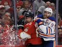 SUNRISE, FLORIDA - JUNE 08: Connor McDavid #97 of the Edmonton Oilers collides with Brandon Montour #62 of the Florida Panthers during the second period in Game One of the 2024 Stanley Cup Final at Amerant Bank Arena on June 08, 2024 in Sunrise, Florida.