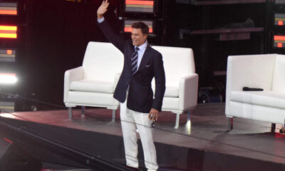 Former New England Patriots quarterback Tom Brady waves as he takes the stage at the Patriots Hall of Fame induction ceremony at Gillette Stadium, Wednesday, June 12, 2024, in Foxborough, Mass. (Steven Senne/AP)