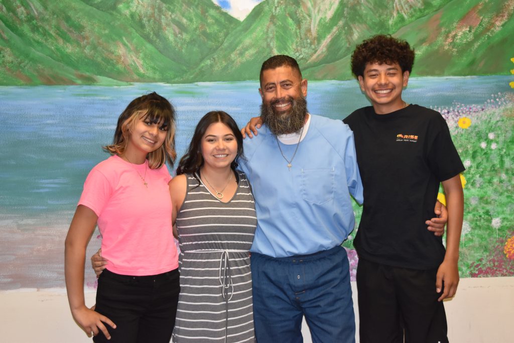 A family visiting their incarcerated loved one.