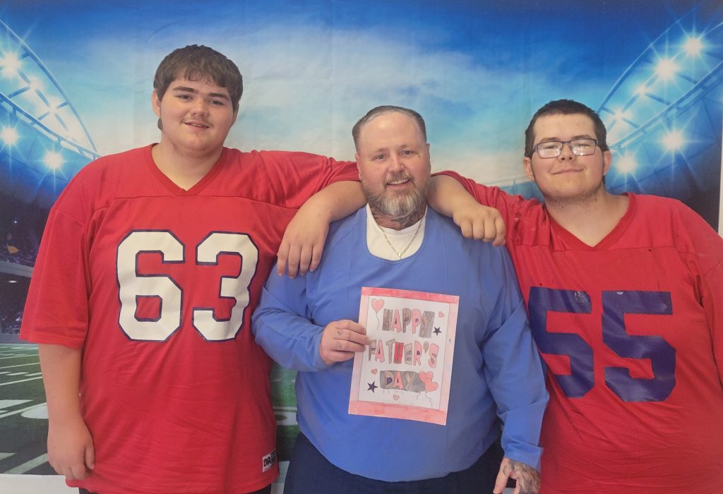 California Correctional Institution incarcerated father with two visiting family members on Father's Day.