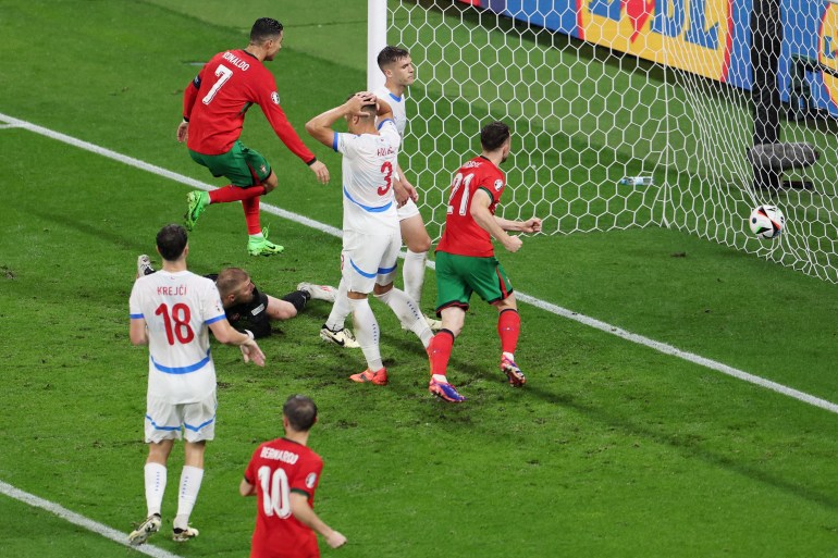 Czech Republic's Robin Hranac scores Portugal's first with an own goal