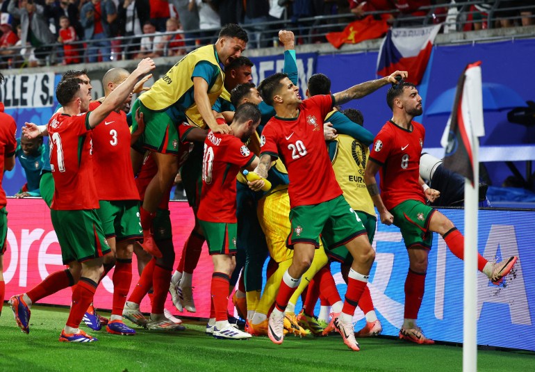 Portugal's Francisco Conceicao celebrates scoring their second goal with teammates
