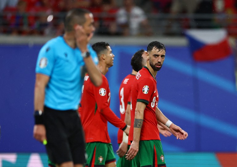 Bruno Fernandes looks disappointedly at the referee