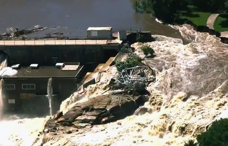 The river has cut around the sides of the dam