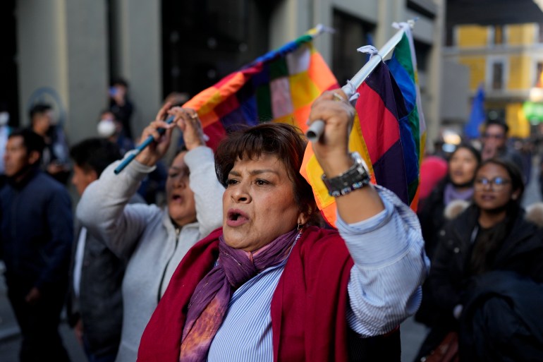 A supporter of Bolivian President Luis Arce enters Plaza Murillo after a failed coup