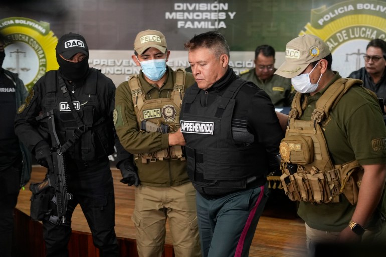 Bolivian police hold the detained Juan Jose Zuniga, former general commander of the Army, in La Paz, Bolivia, Wednesday, June 26, 2024.