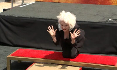 Cyndi Lauper places handprints, footprints outside Hollywood's TCL Chinese Theatre