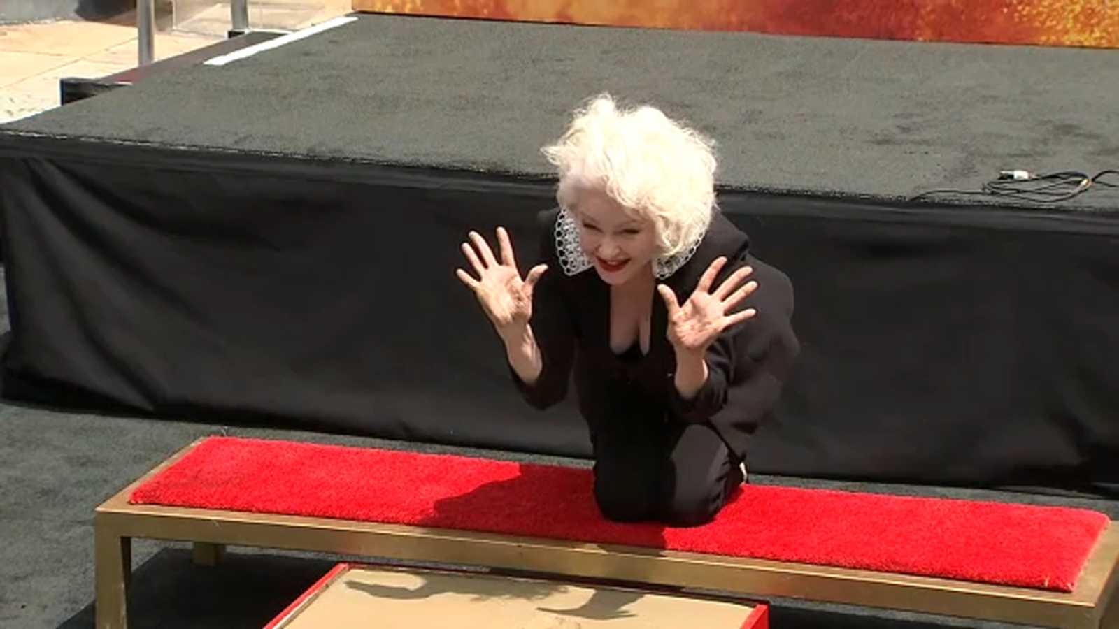 Cyndi Lauper places handprints, footprints outside Hollywood's TCL Chinese Theatre