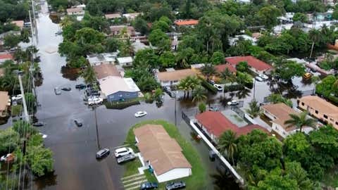 This aerial view taken from video shows a flooded street in Northeast Miami-Dade County on Thursday, June 13, 2024. (AP Photo/Daniel Kozin)