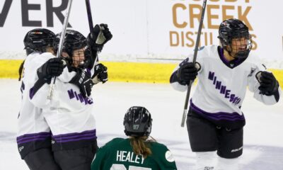 Minnesota forward Liz Schepers, second left, celebrates with teammates Sophie Jaques, left, and Minnesota forward Brittyn Fleming (18) in Game 5 of the PWHL Walter Cup Final. (Mary Schwalm/AP Photo)