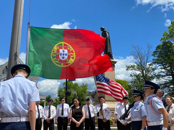 Members of the Taunton Air Force Junior ROTC raise the Portuguese flag outside Taunton City Hall on June 8, 2024.