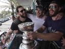 From left, Florida Panthers' Anthony Stolarz, Sam Bennett and Matthew Tkachuk sing 