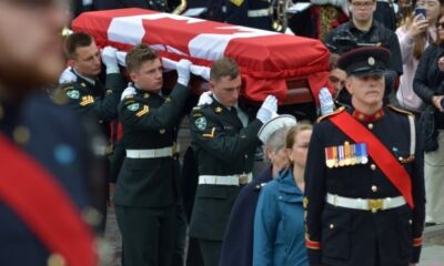 Under grey skies and rain, N.L. entombs its Unknown Soldier in solemn ceremony at war memorial