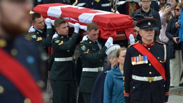 Under grey skies and rain, N.L. entombs its Unknown Soldier in solemn ceremony at war memorial