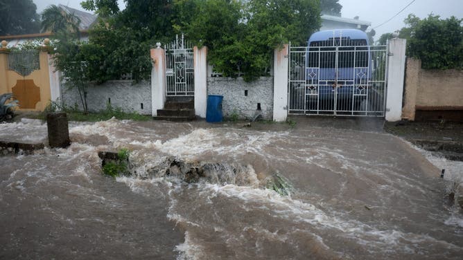 KINGSTON, JAMAICA - JULY 03: Flood waters pour onto the street as Hurricane Beryl passes through the area on July 03, 2024, in Kingston, Jamaica. Beryl has caused widespread damage in several island nations as it continues to cross the Caribbean. (Photo by Joe Raedle/Getty Images)