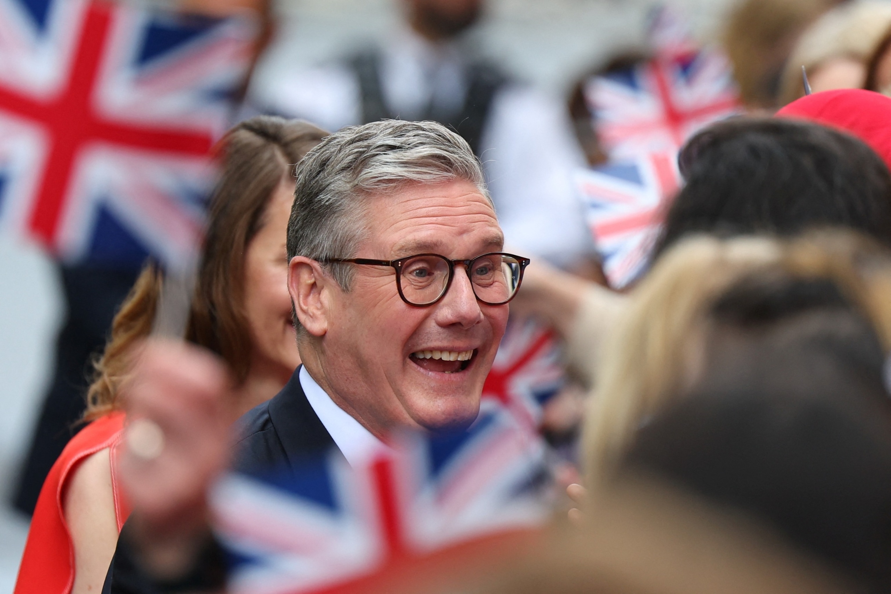 PHOTO: British Prime Minister Keir Starmer greets Labour campaigners and activists at Number 10 Downing Street, following the results of the election, in London, July 5, 2024. 