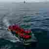 In this drone view, an inflatable dinghy carrying migrants makes its way across the English Channel to Britain, on May 4.