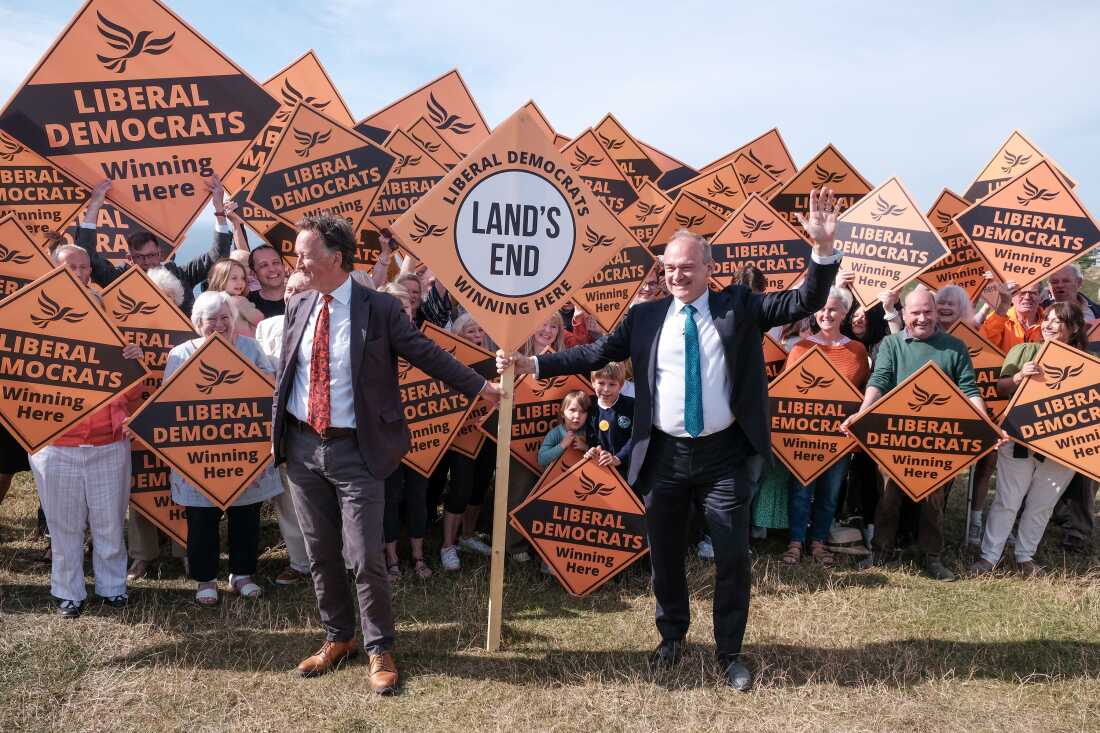 Liberal Democrat leader Ed Davey with parliamentary candidate for St. Ives Andrew George (left), during a visit to Sennen in Cornwall, England, while on the election campaign trail on Tuesday.