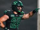 Saskatchewan Roughriders running back Clint Ratkovich (25) celebrates after scoring a touchdown against Winnipeg Blue Bombers during the second half of CFL football action in Regina, on Friday, July 19, 2024.