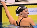 Canada's Summer Mcintosh celebrates after victory in the final of the women's 200m butterfly swimming event during the World Aquatics Championships in 2023.