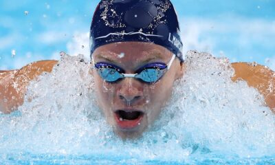 France’s Leon Marchand delights home crowd by winning 400m individual medley gold in Olympic record