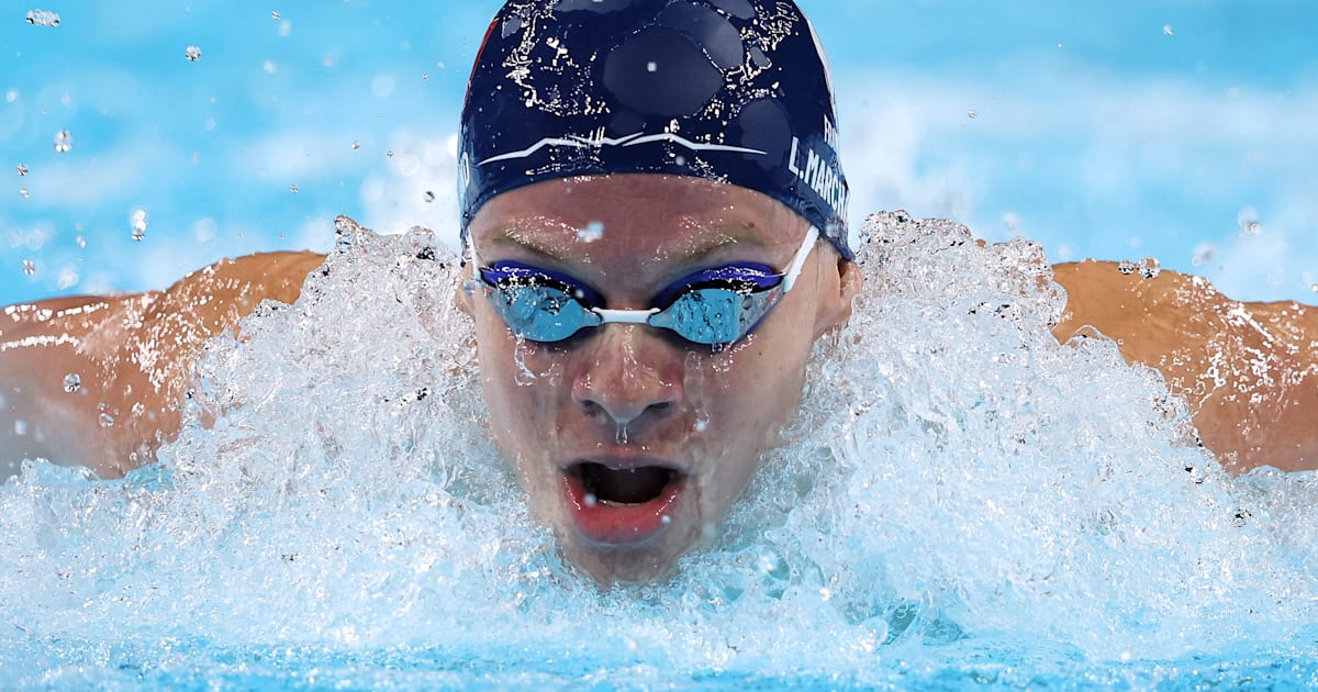 France’s Leon Marchand delights home crowd by winning 400m individual medley gold in Olympic record