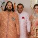 Billionaire tycoon and Chairman of Reliance Industries Mukesh Ambani (C), wife Nita Ambani (R) and son Anant Ambani pose for photos as they arrive to attend the wedding ceremony of Anant and his fiancee Radhika Merchant in Mumbai on July 12, 2024.