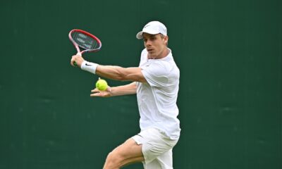 Denis Shapovalov slices a backhand. He lost to Ben Shelton on Saturday at Wimbledon.