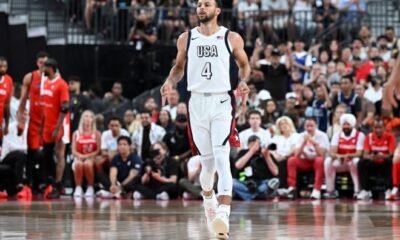 Steph Curry celebrates after scoring against Canada.