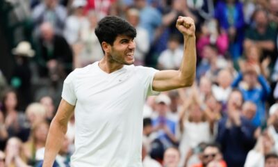 Carlos Alcaraz of Spain celebrates after defeating Tommy Paul of the United States in their quarterfinal match at the Wimbledon tennis championships in London, Tuesday, July 9, 2024. (AP Photo/Kirsty Wigglesworth)