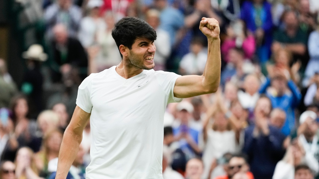 Carlos Alcaraz of Spain celebrates after defeating Tommy Paul of the United States in their quarterfinal match at the Wimbledon tennis championships in London, Tuesday, July 9, 2024. (AP Photo/Kirsty Wigglesworth)